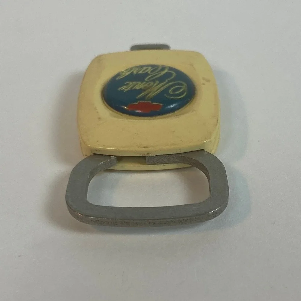 Vintage Chevrolet Monte Carlo Keychain Push Release Cream Blue Gold Bowtie Logo